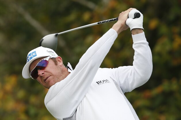 Mikko Ilonen of Finland plays his shot off the 17th tee during his World Match Play Championship semifinal game against Joost Luiten of the Netherlands at the Royal London golf club in Ash, England Sunday, Oct. 19, 2014. Ilonen won the match and will play Henrik Stenson of Sweden in the final, later Sunday. (AP Photo/Alastair Grant)