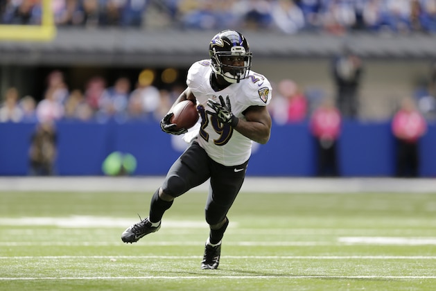 Baltimore Ravens running back Justin Forsett runs against the Indianapolis Colts during the first half of an NFL football game in Indianapolis, Sunday, Oct. 5, 2014. (AP Photo/Jeff Roberson)