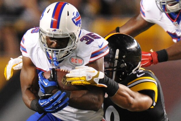 Buffalo Bills running back Bryce Brown (35) tries to get past Pittsburgh Steelers defensive back Lew Toler (48) in the fourth quarter of the NFL football preseason game on Saturday, Aug. 16, 2014 in Pittsburgh. (AP Photo/Don Wright)
