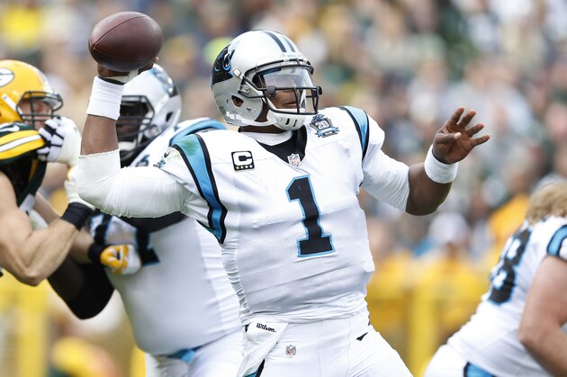 GREEN BAY, WI - OCTOBER 19:  Cam Newton #1 of the Carolina Panthers passes the ball in the first half of the game against the Green Bay Packers at Lambeau Field on October 19, 2014 in Green Bay, Wisconsin. (Photo by Joe Robbins/Getty Images)