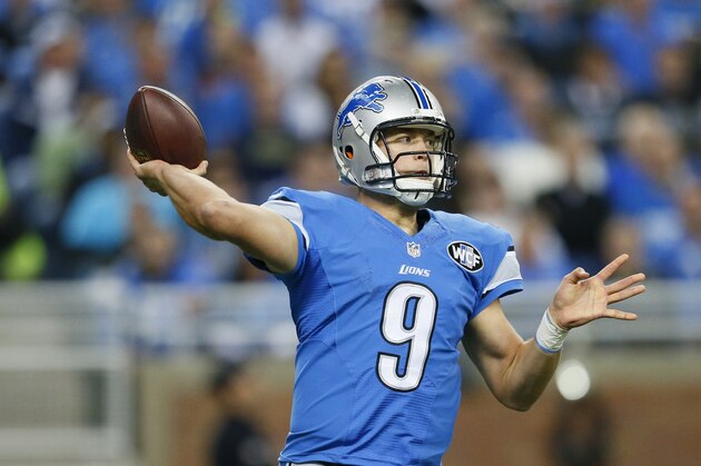 Detroit Lions quarterback Matthew Stafford passes during the first half of an NFL football game against the New Orleans Saints in Detroit, Sunday, Oct. 19, 2014. (AP Photo/Rick Osentoski)