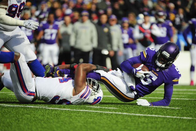 Buffalo Bills defensive end Mario Williams (94) sacks Minnesota Vikings quarterback Teddy Bridgewater (5) during the first half of an NFL football game Sunday, Oct. 19, 2014, in Orchard Park, N.Y.  (AP Photo/Gary Wiepert)