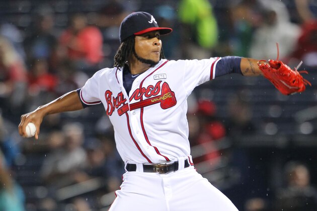 Atlanta Braves starting pitcher Ervin Santana (30) delivers in the fifth inning of a baseball game against the Washington Nationals Monday, Sept. 15, 2014, in Atlanta. (AP Photo/Todd Kirkland)