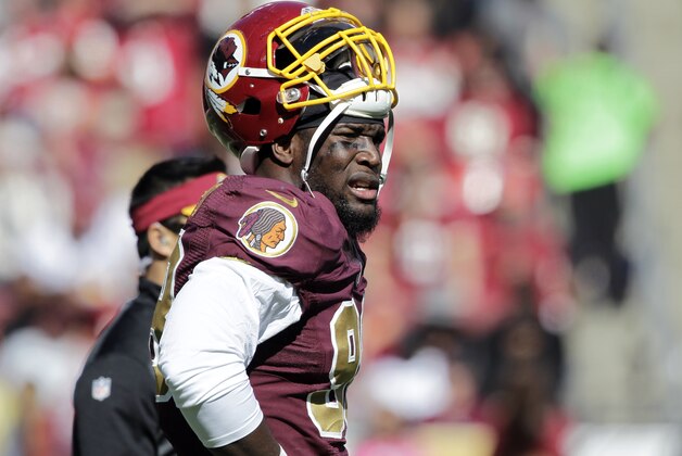 Washington Redskins outside linebacker Brian Orakpo (98) pauses on the field during the first half of an NFL football game against the Tennessee Titans, Sunday, Oct. 19, 2014, in Landover, Md. (AP Photo/Mark E. Tenally)