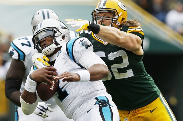 Carolina Panthers' Cam Newton gets away from Green Bay Packers' Clay Matthews during the second half of an NFL football game Sunday, Oct. 19, 2014, in Green Bay, Wis. (AP Photo/Mike Roemer)