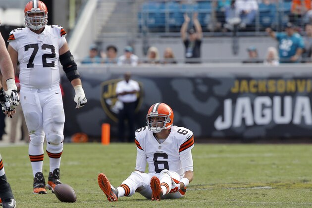 Cleveland Browns quarterback Brian Hoyer (6) sits on the after being sacked by the Jacksonville Jaguars defense during the second half of an NFL football game, Sunday, Oct. 19, 2014, in Jacksonville, Fla. The Jaguars beat the Browns 24-6. (AP Photo/Stephen B. Morton)