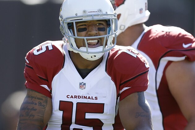 Arizona Cardinals wide receiver Michael Floyd (15) celebrates after catching a 33-yard touchdown pass against the Oakland Raiders during the second quarter of an NFL football game in Oakland, Calif., Sunday, Oct. 19, 2014. (AP Photo/Ben Margot)
