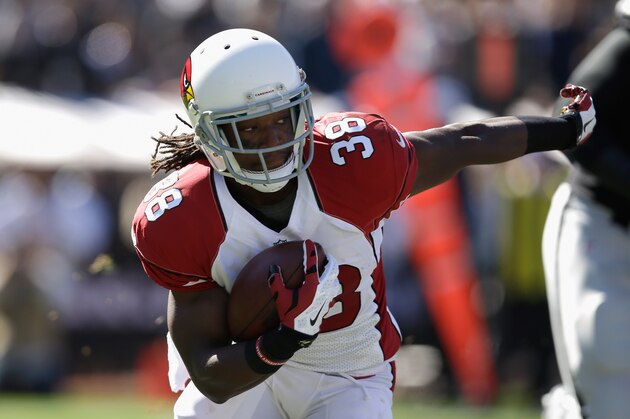 OAKLAND, CA - OCTOBER 19: Andre Ellington #38 of the Arizona Cardinals looks to gain yardage against the Oakland Raiders at O.co Coliseum on October 19, 2014 in Oakland, California.  (Photo by Ezra Shaw/Getty Images)