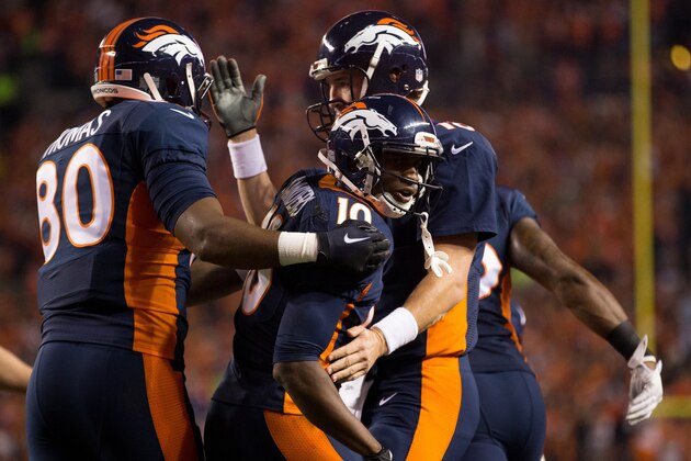 DENVER, CO - OCTOBER 19:  Wide receiver Emmanuel Sanders #10 of the Denver Broncos celebrates a touchdown with Peyton Manning #18 and Julius Thomas #80 in the first quarter of a game against the San Francisco 49ers at Sports Authority Field at Mile High on October 19, 2014 in Denver, Colorado.  (Photo by Justin Edmonds/Getty Images)