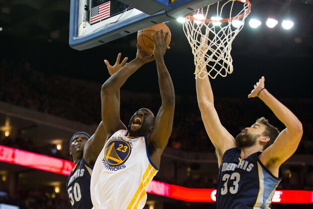 Mar 28, 2014; Oakland, CA, USA; Golden State Warriors forward Draymond Green (23) scores a basket between Memphis Grizzlies forward Zach Randolph (50) and center Marc Gasol (33) during the third quarter at Oracle Arena. The Golden State Warriors defeated the Memphis Grizzlies 100-93. Mandatory Credit: Kelley L Cox-USA TODAY Sports