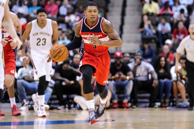 Washington Wizards' Bradley Beal (3)advances the ball against the New Orleans Pelicans during the second half of an NBA preseason basketball game in Jacksonville, Fla., Wednesday, Oct. 8, 2014. Washington won 94-89. (AP Photo/Gary McCullough)
