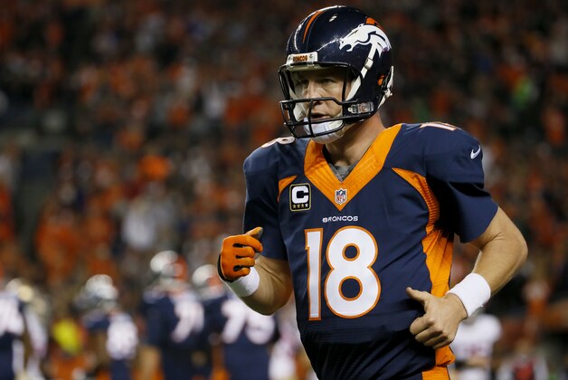Denver Broncos quarterback Peyton Manning (18) runs to celebrate after throwing his 510th career touchdown during the first half of an NFL football game against the San Francisco 49ers, Sunday, Oct. 19, 2014, in Denver.  (AP Photo/Jack Dempsey)