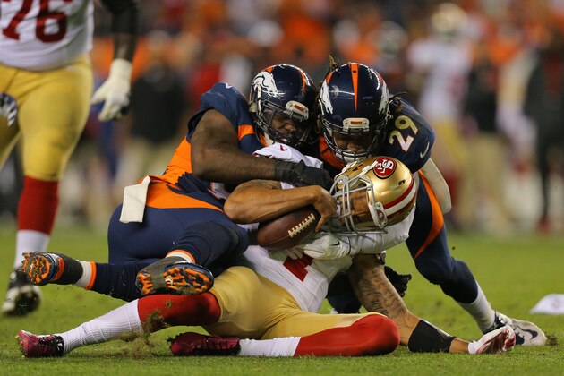 DENVER, CO - OCTOBER 19:  Quarterback Colin Kaepernick #7 of the San Francisco 49ers is sacked in the third quarter by defensive end Malik Jackson #97 of the Denver Broncos as cornerback Bradley Roby #29 comes in at the end of the play at Sports Authority Field at Mile High on October 19, 2014 in Denver, Colorado.  (Photo by Justin Edmonds/Getty Images)