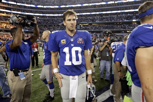 New York Giants quarterback Eli Manning (10) walks off the field following a 31-21 loss to the Dallas Cowboys in an NFL football game, Sunday, Oct.  19, 2014, in Arlington, Texas. (AP Photo/LM Otero)