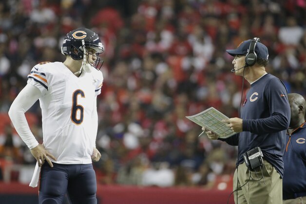 Chicago Bears quarterback Jay Cutler (6) speaks to Chicago Bears head coach Marc Trestman against the Atlanta Falcons during the first half of an NFL football game, Sunday, Oct. 12, 2014, in Atlanta. (AP Photo/David Goldman)