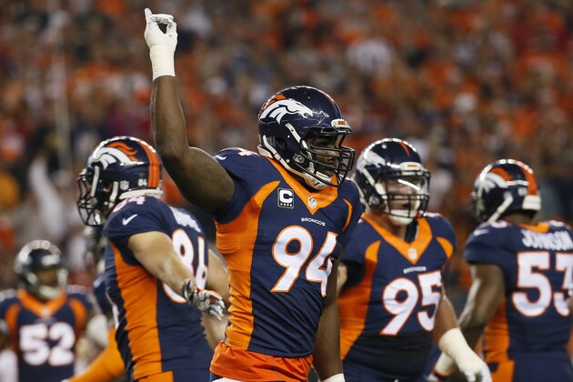 Denver Broncos defensive end DeMarcus Ware celebrates against the San Francisco 49ers during the first half of an NFL football game, Sunday, Oct. 19, 2014, in Denver.  (AP Photo/Jack Dempsey)