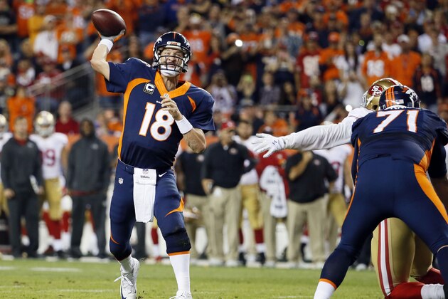 Denver Broncos quarterback Peyton Manning throws his 509th career touchdown pass to set the all time record during the first half of an NFL football game against the San Francisco 49ers, Sunday, Oct. 19, 2014, in Denver. (AP Photo/Jack Dempsey)