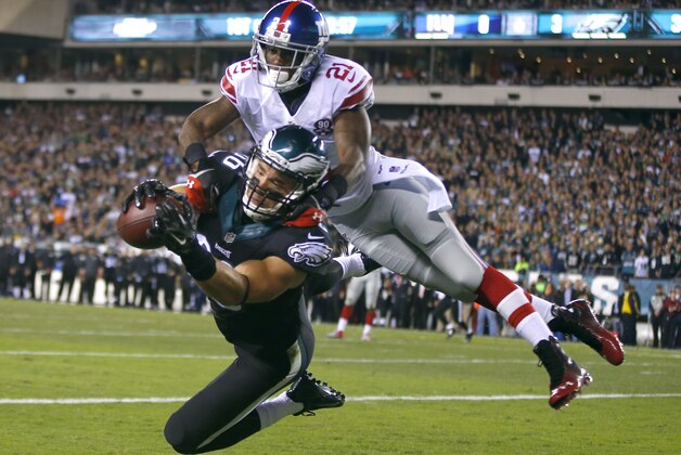 Philadelphia Eagles tight end Zach Ertz (86) makes a touchdown catch against New York Giants cornerback Dominique Rodgers-Cromartie (21) during the first half of an NFL football game, Sunday, Oct. 12, 2014, in Philadelphia. (AP Photo/Matt Rourke)