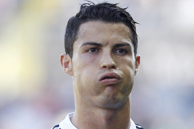 Real Madrid's Cristiano Ronaldo, from Portugal reacts after failing to score against Levante during a Spanish La Liga soccer match at the Ciutat de Valencia stadium in Valencia, Spain, on Saturday, Oct. 18, 2014. (AP Photo/Alberto Saiz)