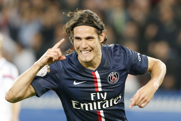 Paris Saint  Germain's Edinson Cavani celebrates his goal against Olympic Lyonnais during their French League One soccer match Sunday, Sept. 21, 2014, at Parc des Princes stadium, in Paris, France. (AP Photo/Jacques Brinon)
