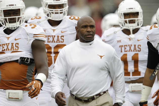 Texas head coach Charlie Strong walks on the field before an NCAA college football game  against Oklahoma at the Cotton Bowl, Saturday, Oct. 11, 2014, in Dallas. (AP Photo/LM Otero)