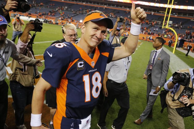 Denver Broncos quarterback Peyton Manning (18) leaves the field after an NFL football game against the San Francisco 49ers, Sunday, Oct. 19, 2014, in Denver.  The Broncos won 42-17. (AP Photo/Jack Dempsey)