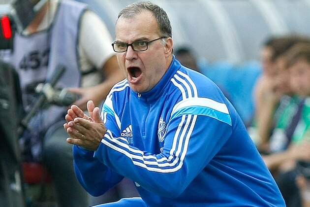 Marseille's Argentinian coach Marcelo Bielsa cheers on his team during their League One soccer match  against Toulouse, at the Velodrome Stadium, in Marseille, southern France, Sunday, Oct. 19, 2014. (AP Photo/Claude Paris)