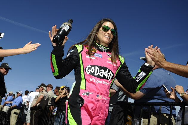 Danica Patrick is greeted by fans after driver introductions before the start of the  NASCAR Sprint Cup Series auto race at Talladega Superspeedway Sunday, Oct. 19, 2014, in Talladega, Ala.   (AP Photo/Rainier Ehrhardt)