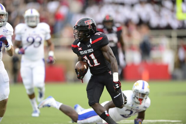 LUBBOCK, TX - OCTOBER 18: Jakeem Grant #11 of the Texas Tech Red Raiders  carries the ball against the Kansas Jayhawks on October 18, 2014 at Jones AT&T Stadium in Lubbock, Texas. Texas Tech won the game 34-21.(Photo by John Weast/Getty Images)