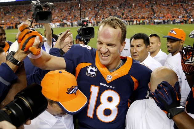 Denver Broncos quarterback Peyton Manning (18) celebrates his 509th career touchdown pass with teammates during the first half of an NFL football game against the San Francisco 49ers, Sunday, Oct. 19, 2014, in Denver.  (AP Photo/Jack Dempsey)