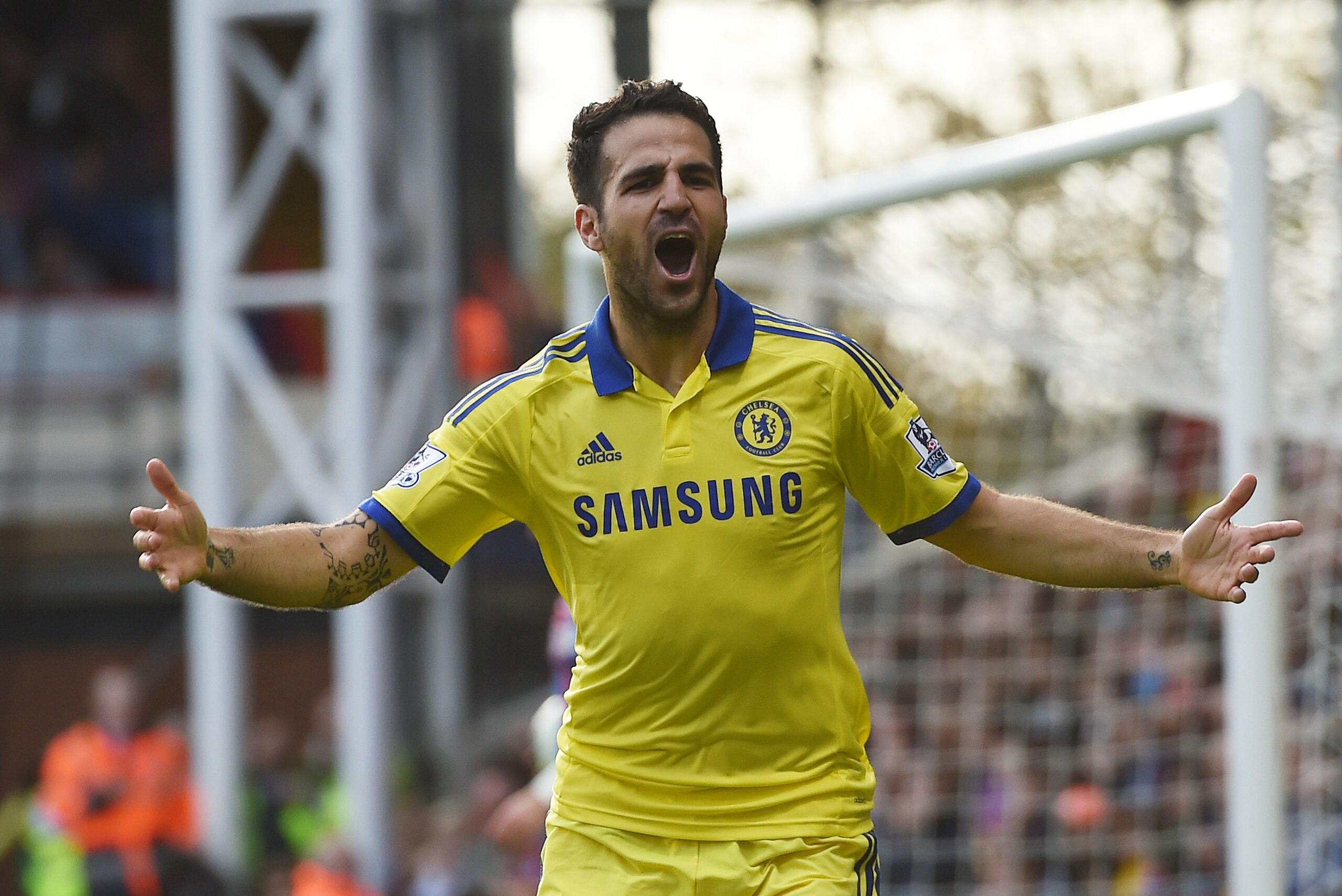 Chelsea’s Cesc Fabregas celebrates scoring his team's second goal during their English Premier League soccer match against Crystal Palace at Selhurst Park, London, Saturday, Oct. 18, 2014. (AP Photo/Tim Ireland)