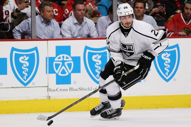CHICAGO, IL - MAY 21:  Slava Voynov #26 of the Los Angeles Kings controls the puck against the Chicago Blackhawks in Game Two of the Western Conference Final during the 2014 Stanley Cup Playoffs at United Center on May 21, 2014 in Chicago, Illinois.  (Photo by Jonathan Daniel/Getty Images)