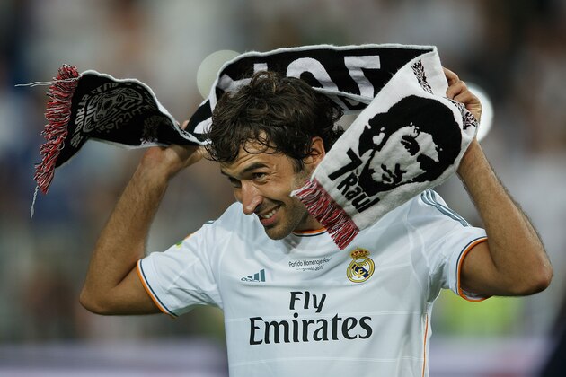 MADRID, SPAIN - AUGUST 22:  Former Real Madrid player Raul, donning a towel bearing his likeness, acknowledges the crowd after the Santiago Bernabeu Trophy match between Real Madrid CF and Al-Sadd at Estadio Santiago Bernabeu on August 22, 2013 in Madrid, Spain.  (Photo by Gonzalo Arroyo Moreno/Getty Images)