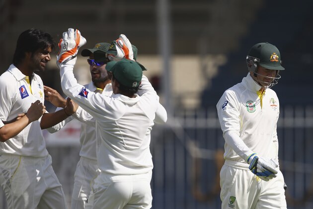 SHARJAH, UNITED ARAB EMIRATES - OCTOBER 18:  Michael Clarke of Australia leaves the field after being dismissed by Rahat Ali of Pakistan A during day four of the tour match between Australia and Pakistan A at Sharjah Cricket Stadium on October 18, 2014 in Sharjah, United Arab Emirates.  (Photo by Francois Nel/Getty Images)