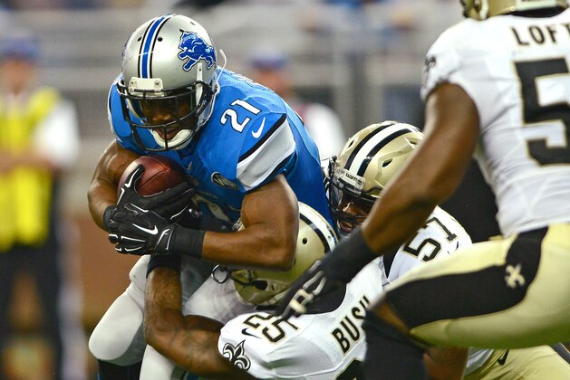 Oct 19, 2014; Detroit, MI, USA; Detroit Lions running back Reggie Bush (21) is tackled by New Orleans Saints free safety Rafael Bush (25) during the second quarter at Ford Field. Mandatory Credit: Andrew Weber-USA TODAY Sports