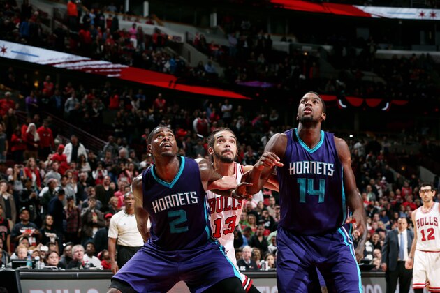 CHICAGO, IL - OCTOBER 19: Marvin Williams #2 and Michael Kidd-Gilchrist #14 of the Charlotte Hornets battle for position against Joakim Noah #13 of the Chicago Bulls on October 19, 2014 at United Center, Chicago, Illinois. NOTE TO USER: User expressly acknowledges and agrees that, by downloading and or using this Photograph, user is consenting to the terms and conditions of the Getty Images License Agreement. Mandatory Copyright Notice: Copyright 2014 NBAE (Photo by Gary Dineen/NBAE via Getty Images)