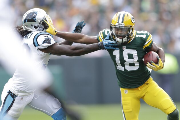 GREEN BAY, WI - OCTOBER 19: Randall Cobb #18 of the Green Bay Packers makes the catch and runs upfield with the football during the first quarter against the Carolina Panthers at Lambeau Field on October 19, 2013 in Green Bay, Wisconsin. (Photo by Mike McGinnis/Getty Images)