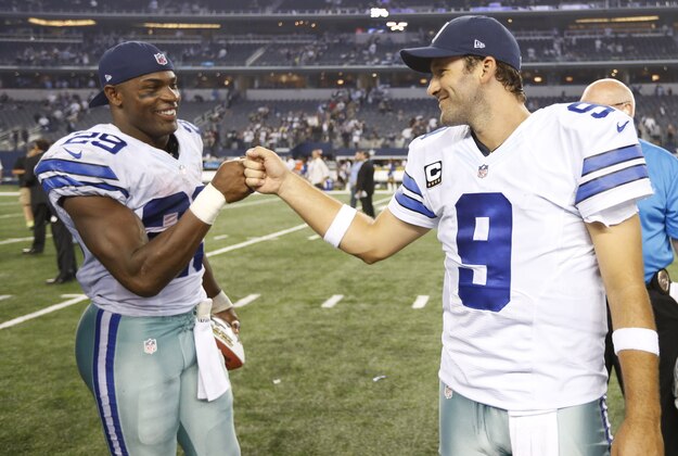 Sep 28, 2014; Arlington, TX, USA; Dallas Cowboys running back DeMarco Murray (29) celebrates with quarterback Tony Romo (9) after the game against the New Orleans Saints at AT&T Stadium. The Cowboys beat the Saints 38-17. Mandatory Credit: Matthew Emmons-USA TODAY Sports