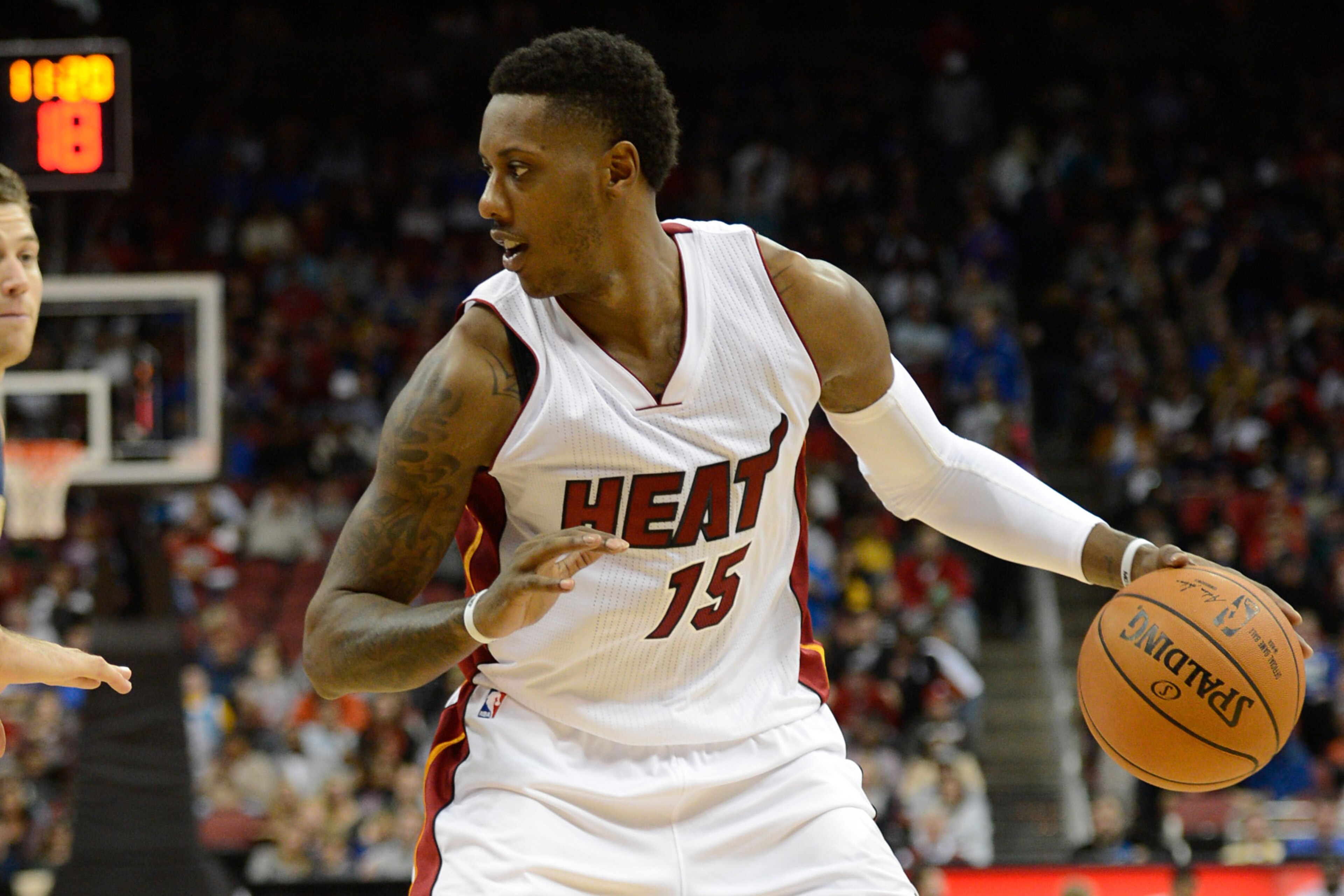 Oct 4, 2014; Louisville, KY, USA; Miami Heat guard Mario Chalmers (15) dribbles against the New Orleans Pelicans during the second half of play at KFC Yum! Center. New Orleans defeated Miami 98-86.  Mandatory Credit: Jamie Rhodes-USA TODAY Sports