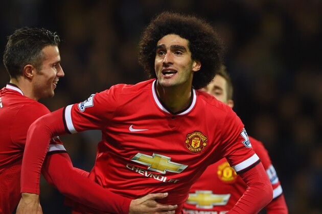 WEST BROMWICH, ENGLAND - OCTOBER 20:  Marouane Fellaini of Manchester United celebrates with Robin van Persie (L) and Adnan Januzaj (R) as he scores their first and equalising goal during the Barclays Premier League match between West Bromwich Albion and Manchester United at The Hawthorns on October 20, 2014 in West Bromwich, England.  (Photo by Michael Regan/Getty Images)