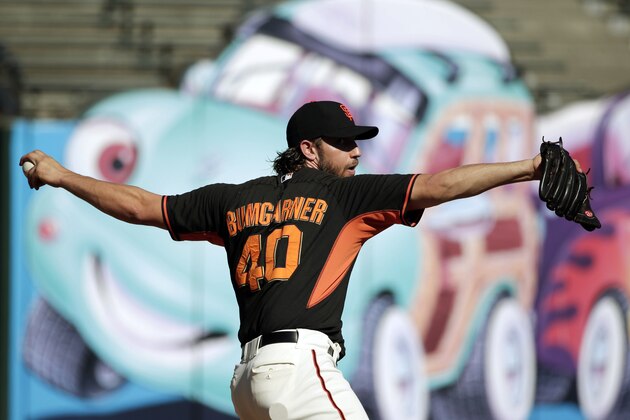 San Francisco Giants starting pitcher Madison Bumgarner throws during a team workout Saturday, Oct. 18, 2014, in San Francisco. The Giants are scheduled to play the Kansas City Royals in Game 1 of baseball's World Series on Tuesday in Kansas City, Mo. (AP Photo/Marcio Jose Sanchez)