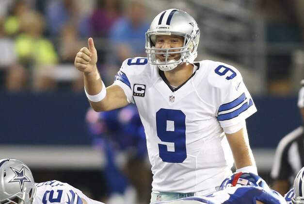 Oct 19, 2014; Arlington, TX, USA; Dallas Cowboys quarterback Tony Romo (9) calls a play at the line of scrimmage during the fourth quarter against the New York Giants at AT&T Stadium. Dallas beat New York 31-21. Mandatory Credit: Tim Heitman-USA TODAY Sports