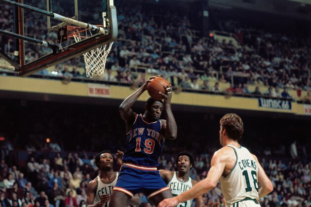 BOSTON - 1973:  Willis Reed #19 of the New York Knicks pulls down the rebound during the Eastern Conference Finals played in 1973 at the Boston Garden in Boston, Massachussetts. NOTE TO USER: User expressly acknowledges and agrees that, by downloading and or using this photograph, User is consenting to the terms and conditions of the Getty Images License Agreement. Mandatory Copyright Notice: Copyright 1973 NBAE (Photo by Dick Raphael/NBAE via Getty Images)