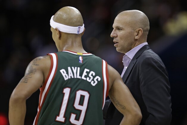 Milwaukee Bucks coach Jason Kidd, right, talks with Jerryd Bayless during the fourth quarter of an NBA preseason basketball game against the Cleveland Cavaliers on Tuesday, Oct. 14, 2014, in Cleveland. The Cavaliers defeated the Bucks 106-100. (AP Photo/Tony Dejak)