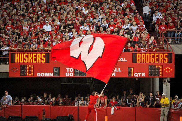 LINCOLN, NE - SEPTEMBER 29: A Wisconsin Badgers flag corp member waves their flag after the football team scores against the Nebraska Cornhuskers during their game at Memorial Stadium on September 29, 2012 in Lincoln, Nebraska. (Photo by Eric Francis/Getty Images)