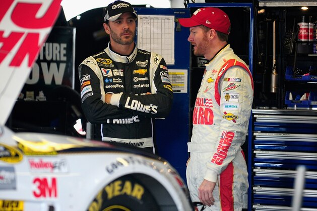 LONG POND, PA - JUNE 06:  (L-R) Jimmie Johnson, driver of the #48 Lowe's/Kobalt Tools Chevrolet, talks with Dale Earnhardt Jr., driver of the #88 National Guard Chevrolet, in the garage area during practice for the NASCAR Sprint Cup Series Pocono 400 at Pocono Raceway on June 6, 2014 in Long Pond, Pennsylvania.  (Photo by Jeff Curry/Getty Images)