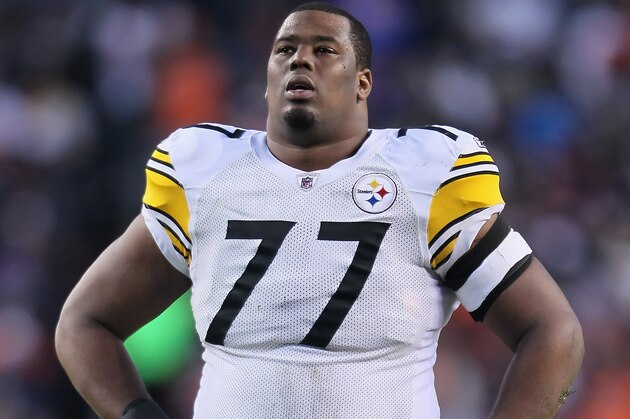 DENVER, CO - JANUARY 08:  Marcus Gilbert #77 of the Pittsburgh Steelers looks on against the Denver Broncos during the Wild Card Playoffs at Sports Authority Field at Mile High on January 8, 2012 in Denver, Colorado.  (Photo by Jeff Gross/Getty Images)