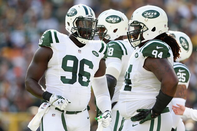 GREEN BAY, WI - SEPTEMBER 14:  Defensive end Muhammad Wilkerson #96 of the New York Jets talks with nose tackle Damon Harrison #94 during the NFL game against the Green Bay Packers at Lambeau Field on September 14, 2014 in Green Bay, Wisconsin.  The Packers defeated the Jets 31-24.  (Photo by Christian Petersen/Getty Images)