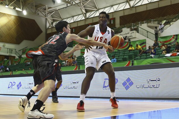 DUBAI, UNITED ARAB EMIRATES - AUGUST 12:Caleb Swanigan of the United States competes for the ball with Hiroto Gunji of Japan during the FIBA U17 World Championships Group Match between Japan and United States of America at Al Shabab Club on August 12, 2014 in Dubai, United Arab Emirates.  (Photo by Francois Nel/Getty Images)
