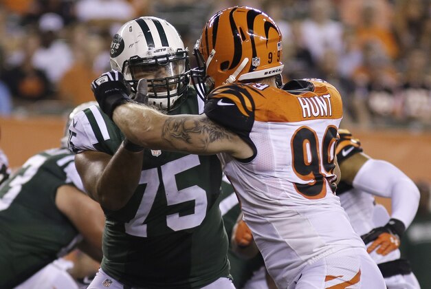 Cincinnati Bengals defensive end Margus Hunt (99) rushes New York Jets offensive tackle Oday Aboushi (75) during an NFL preseason football game, Saturday, Aug. 16, 2014, in Cincinnati. (AP Photo/Tony Tribble)